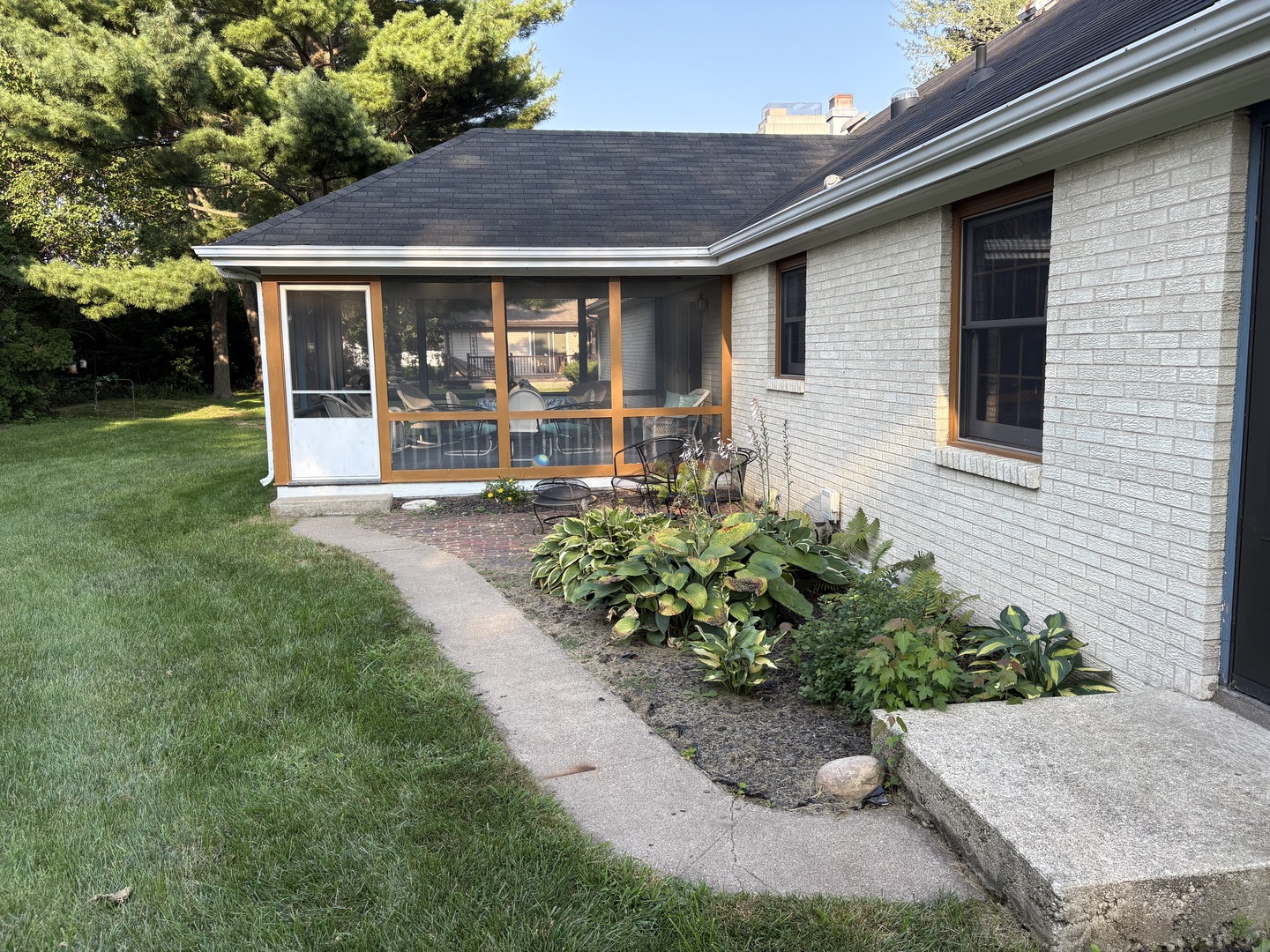 203 Drake Avenue Rochelle, IL 61068 - Photo 54 of 54 a front view of a house with garden
