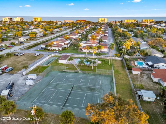 an aerial view of residential houses with outdoor space