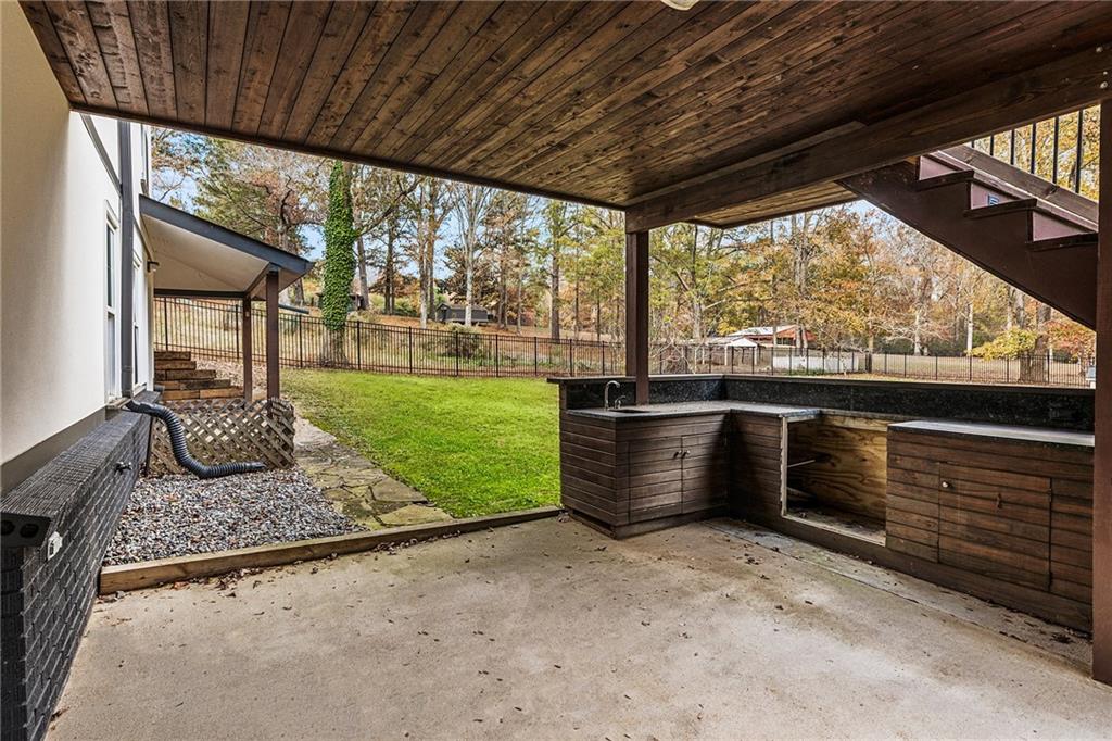 14440 Cogburn Road Alpharetta, GA 30004 - Photo 43 of 62 a view of outdoor space and barbecue grill