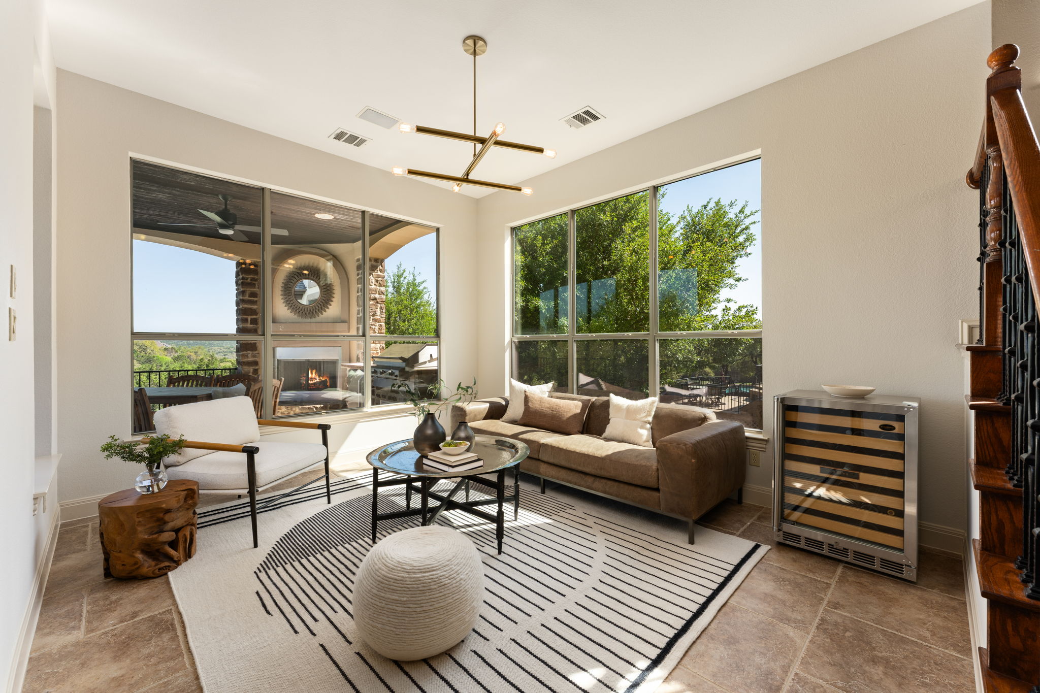 205 Emerald Ridge Drive Austin, TX 78732 - Photo 12 of 40 a living room with furniture and a large window