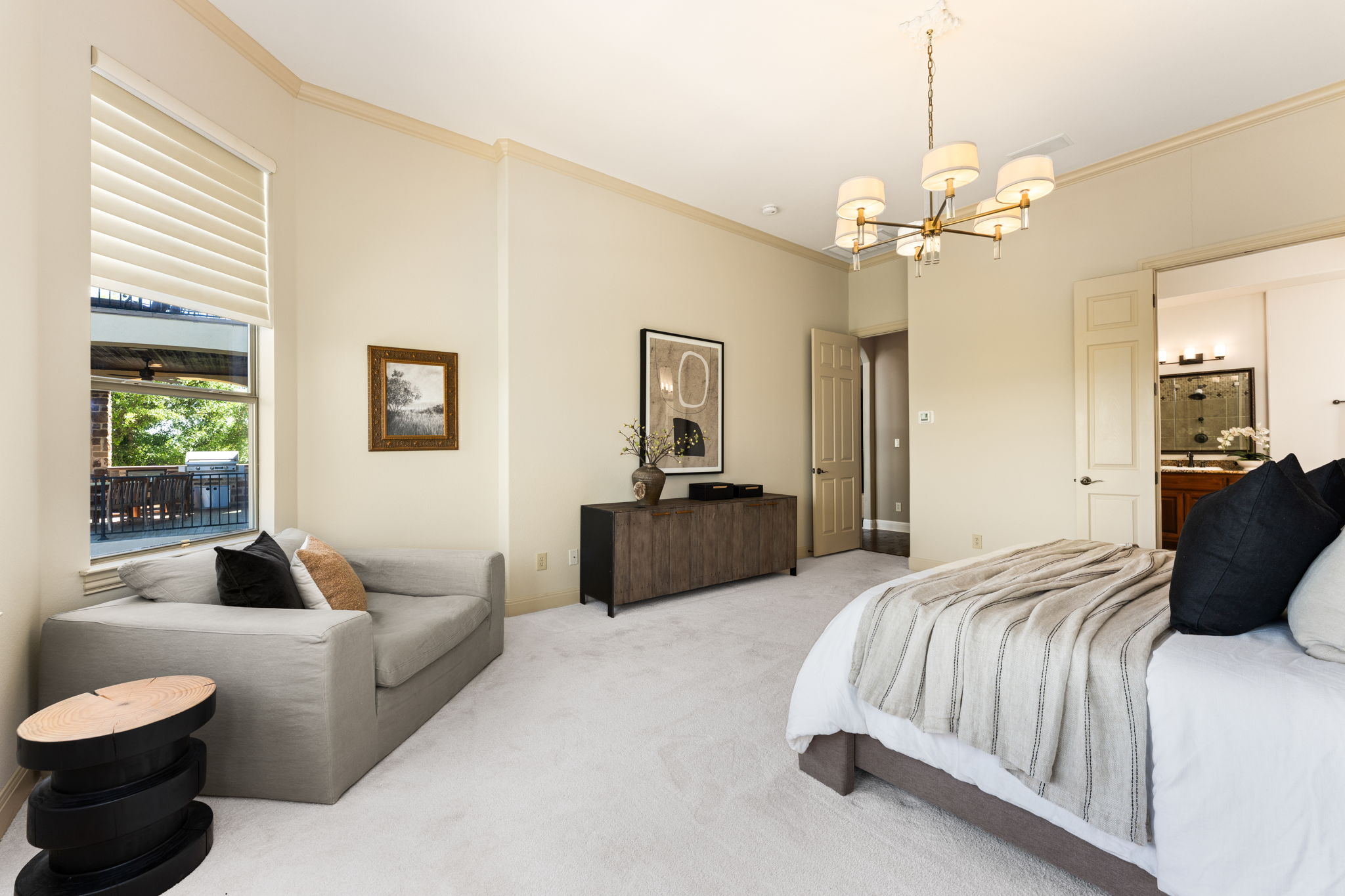 205 Emerald Ridge Drive Austin, TX 78732 - Photo 16 of 40 a spacious bedroom with a bed and a couch