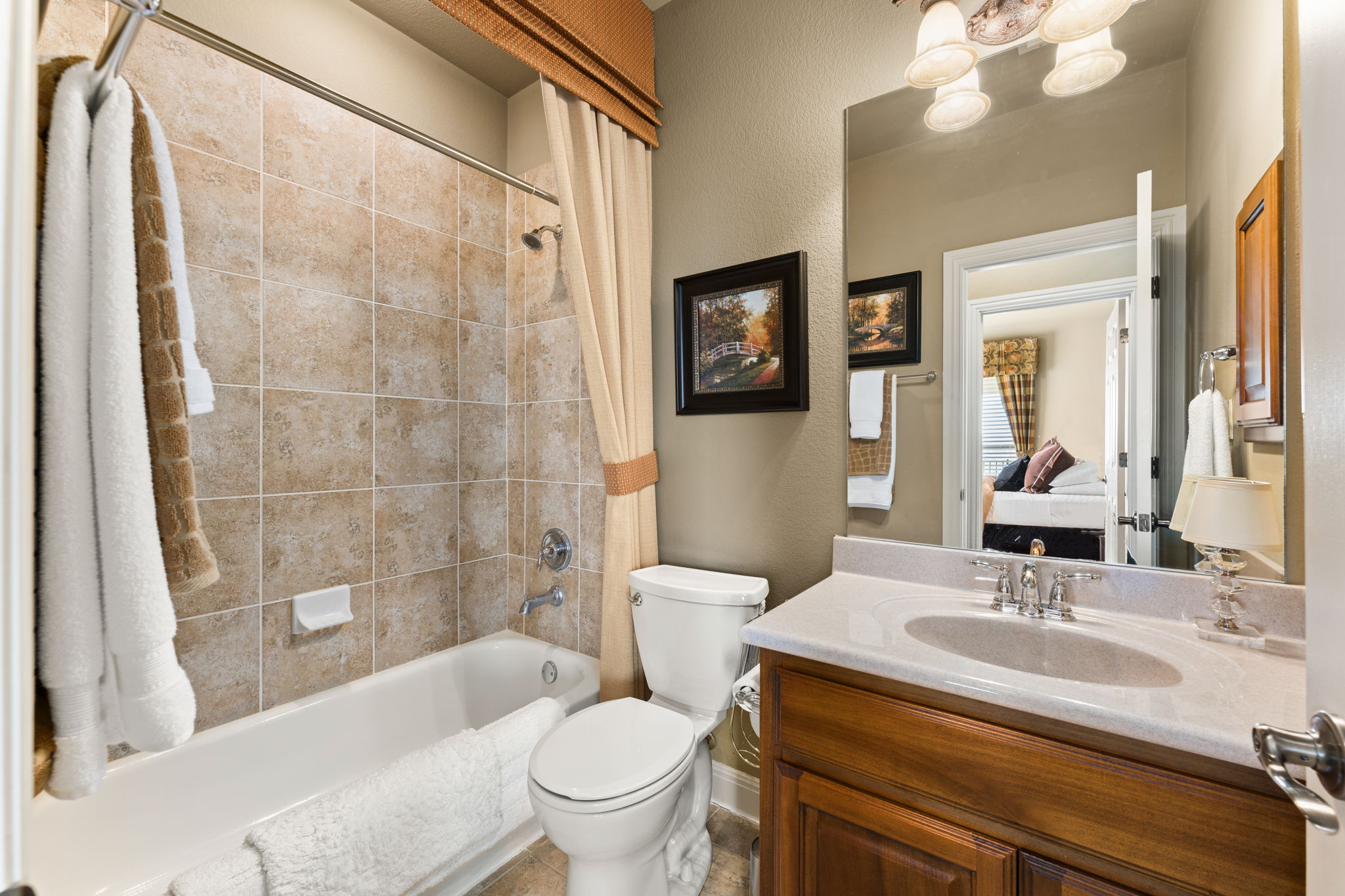 205 Emerald Ridge Drive Austin, TX 78732 - Photo 23 of 40 a bathroom with a sink toilet and shower