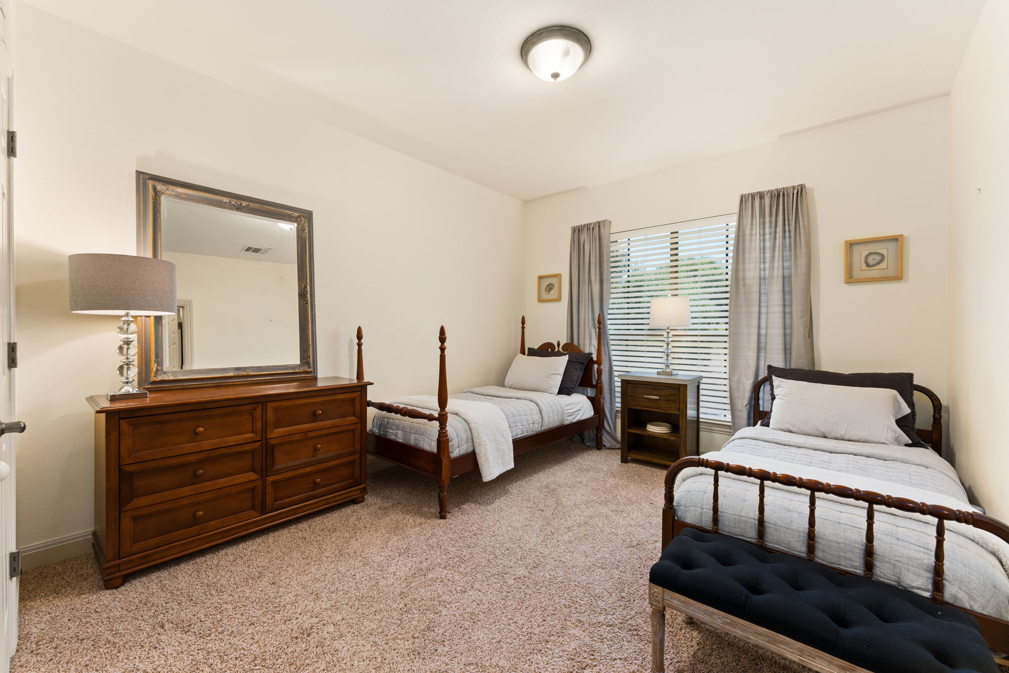 205 Emerald Ridge Drive Austin, TX 78732 - Photo 24 of 40 a bedroom with bed and window