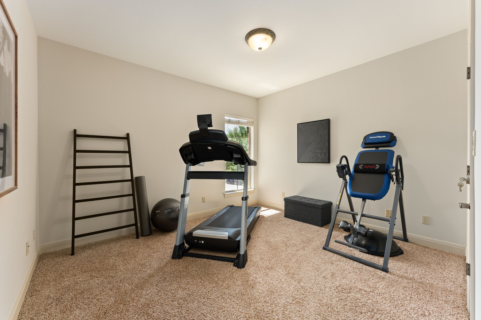 205 Emerald Ridge Drive Austin, TX 78732 - Photo 26 of 40 a bedroom with furniture and a window