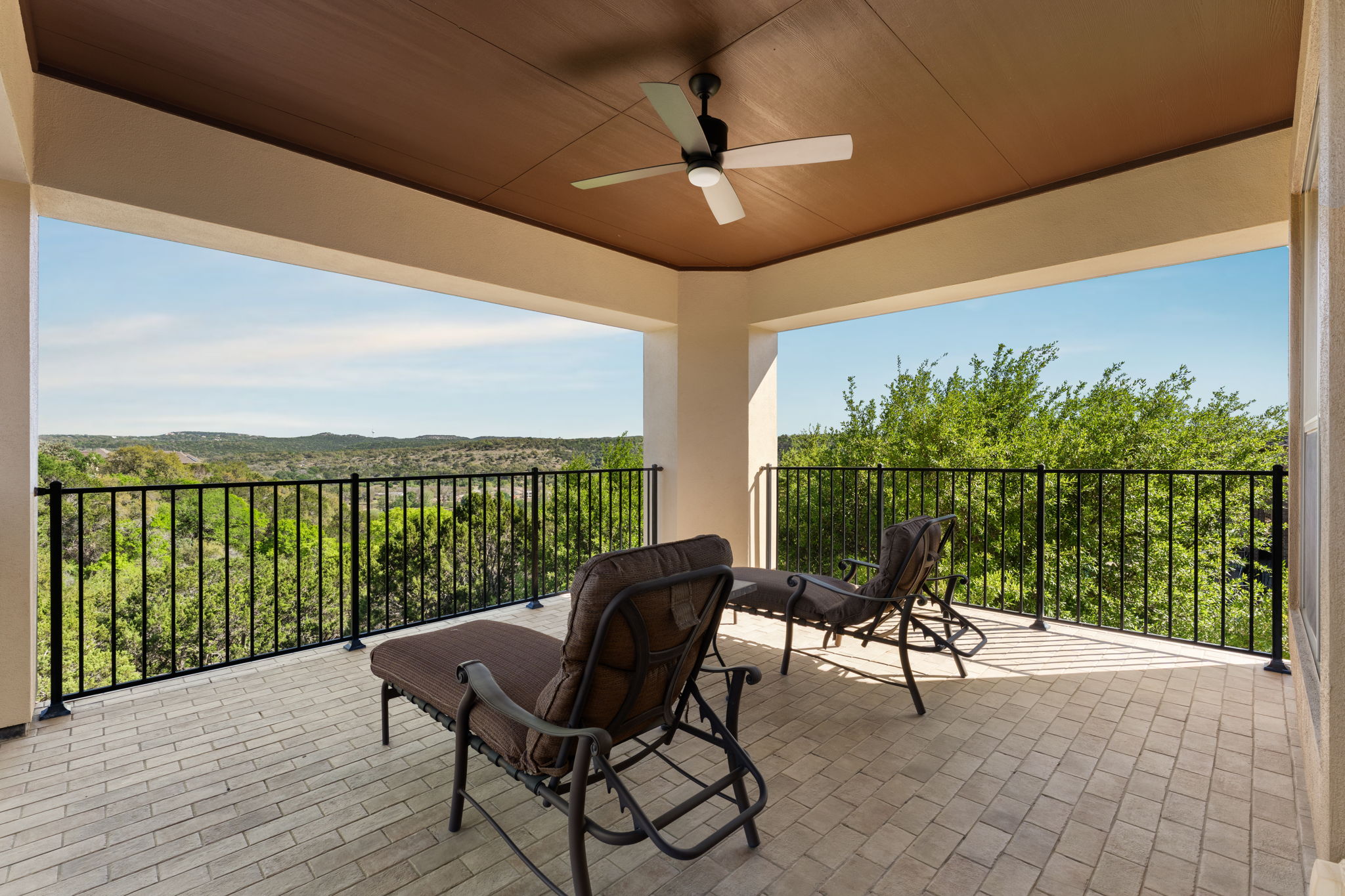 205 Emerald Ridge Drive Austin, TX 78732 - Photo 30 of 40 a view of a chairs and table in patio of the house