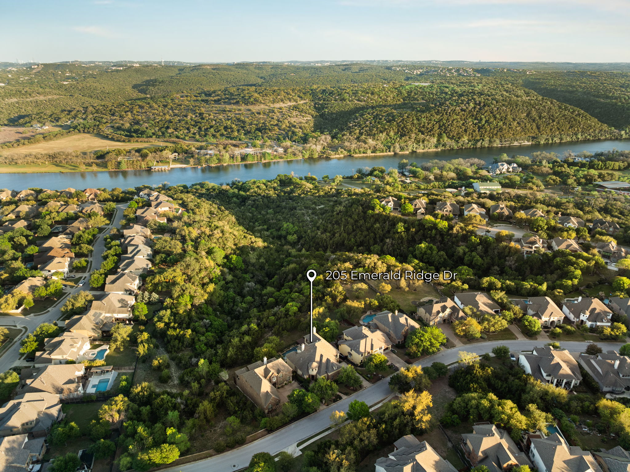 205 Emerald Ridge Drive Austin, TX 78732 - Photo 36 of 40 an aerial view of residential building and lake