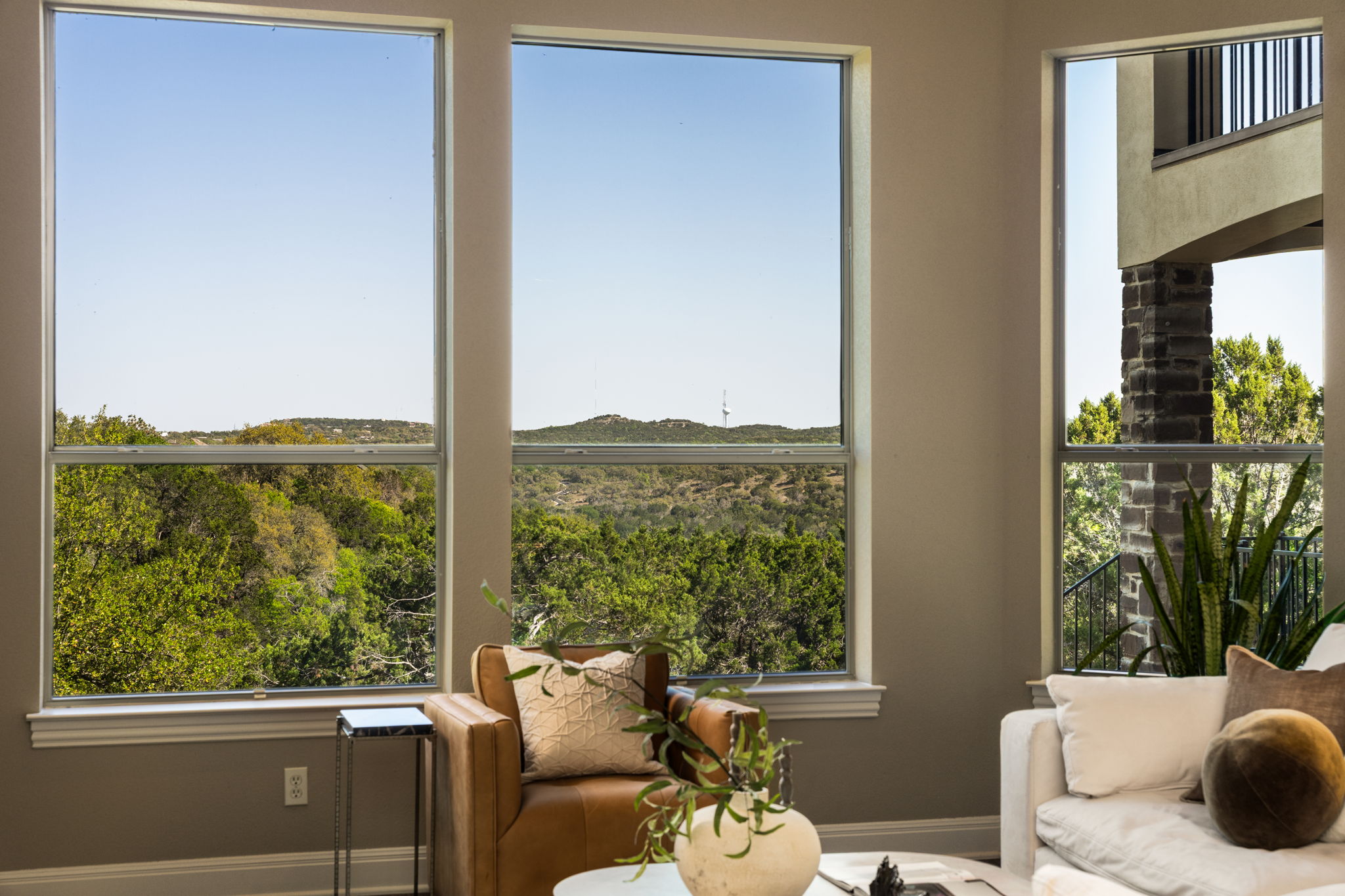 205 Emerald Ridge Drive Austin, TX 78732 - Photo 7 of 40 a living room with furniture and a window