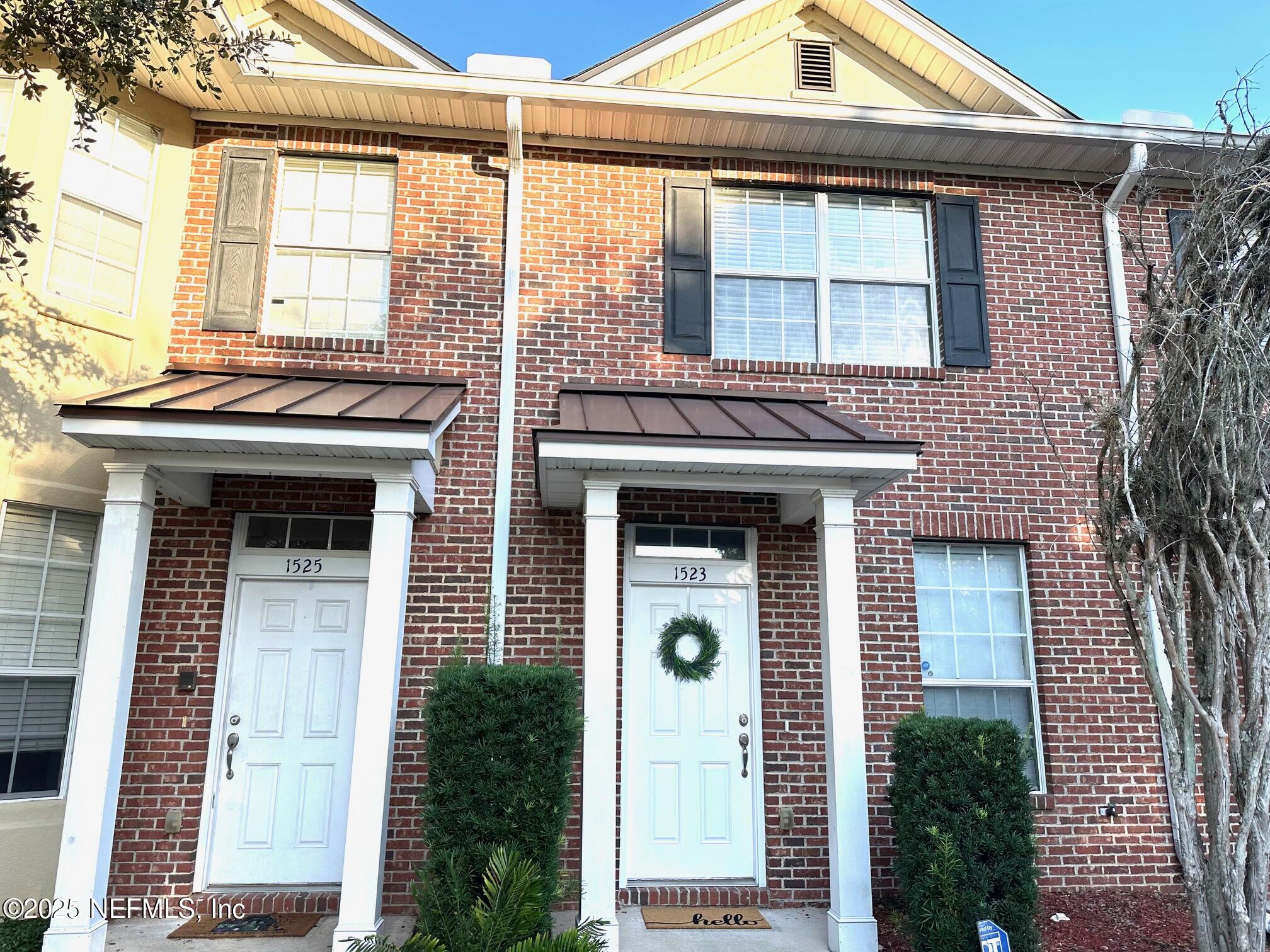 a front view of a house with a porch