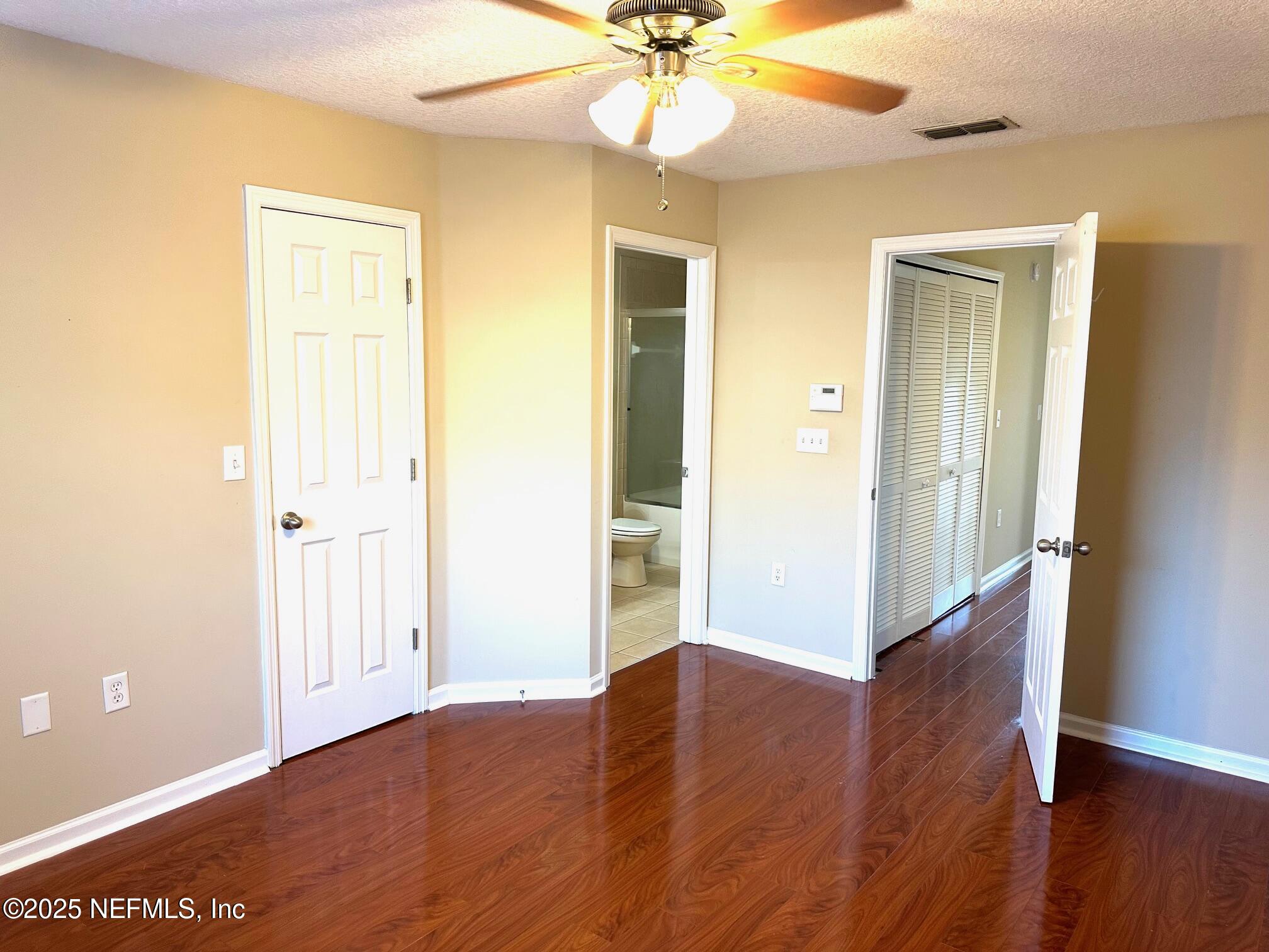1523 Fieldview Drive Jacksonville, FL 32225 - Photo 11 of 23 a view of an empty room with wooden floor