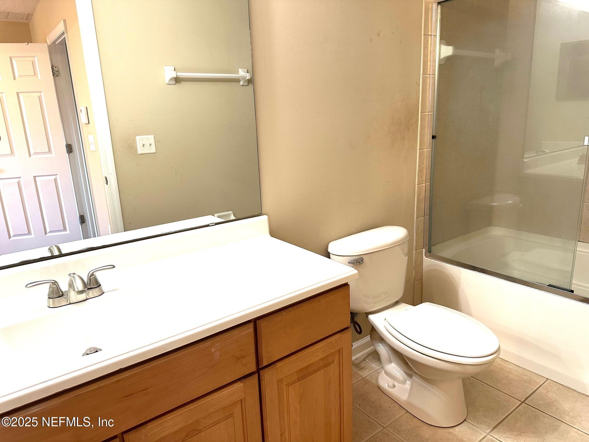 1523 Fieldview Drive Jacksonville, FL 32225 - Photo 13 of 23 a white toilet sitting next to a bathroom sink
