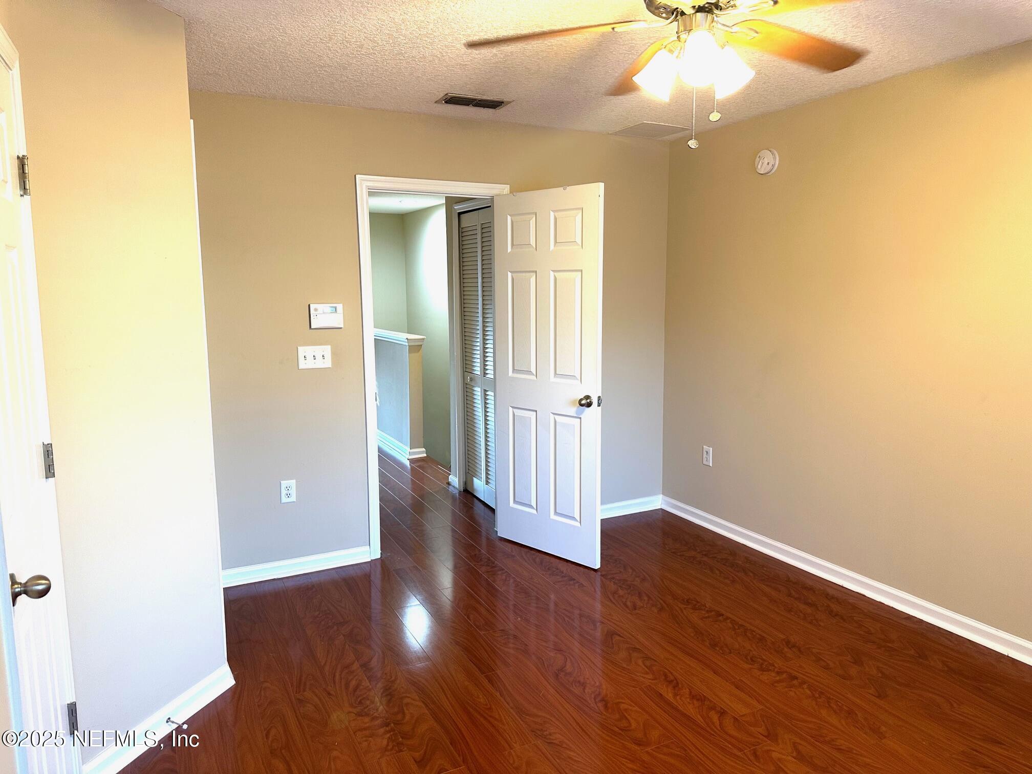 1523 Fieldview Drive Jacksonville, FL 32225 - Photo 14 of 23 a view of an empty room with wooden floor