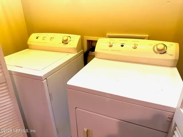 a utility room with dryer and washer