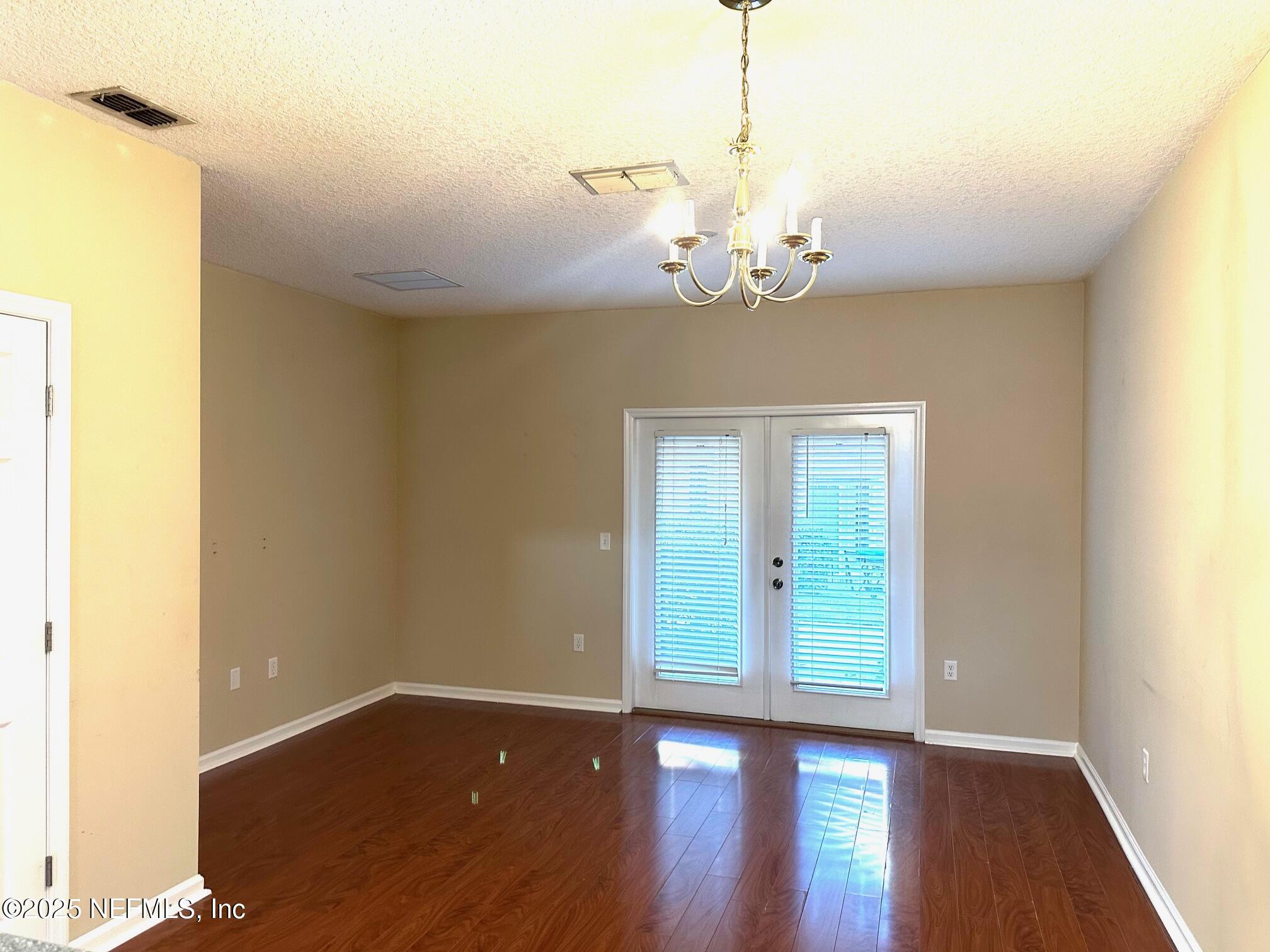 1523 Fieldview Drive Jacksonville, FL 32225 - Photo 5 of 23 a view of a room with wooden floor and chandelier