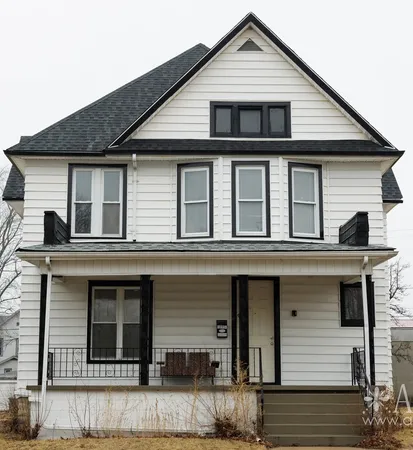 a front view of a house with a balcony