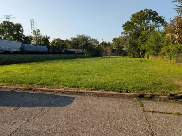 swimming pool view with a seating space and a garden view