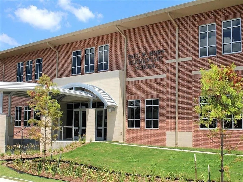 4301 Effie Street Bellaire, TX 77401 - Photo 6 of 14 front view of a brick house with a yard