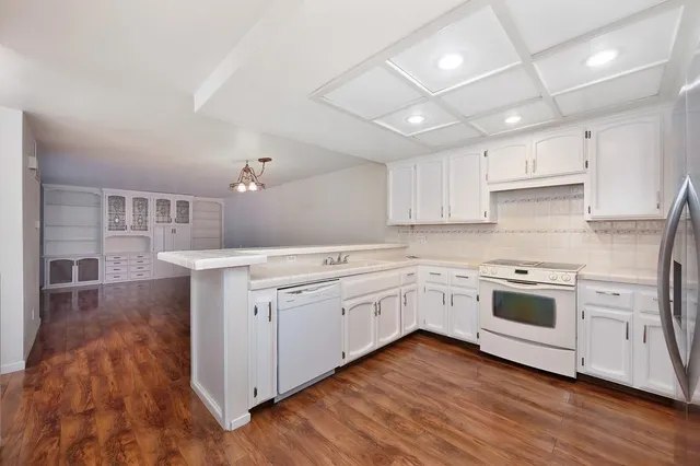a view of a house with a wooden deck