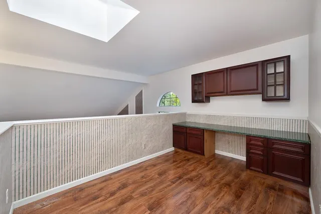 a view of a park with large trees