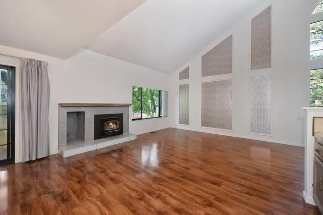 a kitchen with stainless steel appliances a refrigerator and a stove top oven