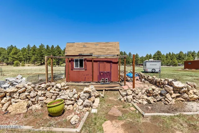 a view of a chairs and table in the patio