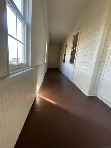 a view of a hallway with staircase