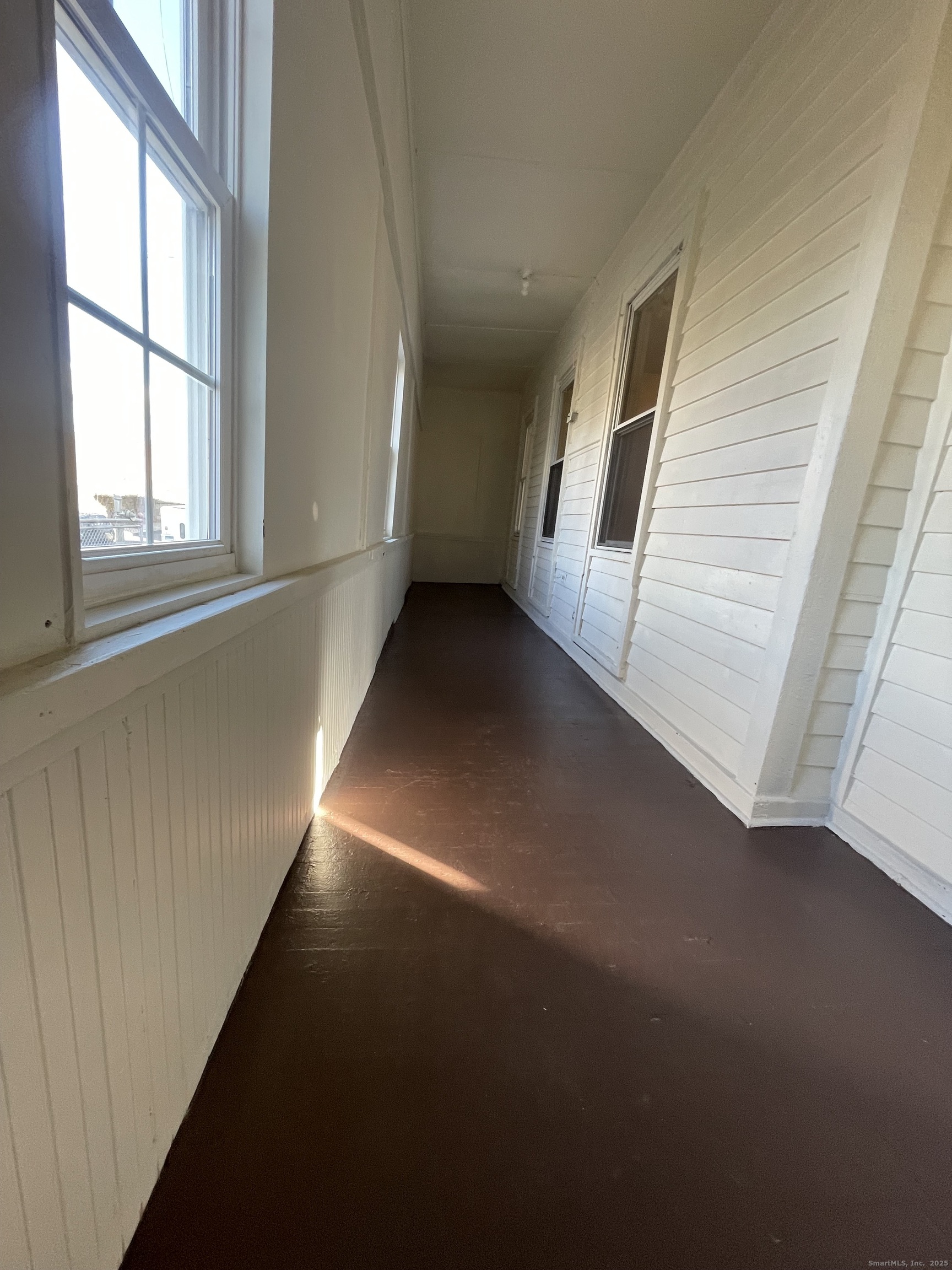 26 Clarence Street, Unit 1 Bridgeport, CT 06608 - Photo 16 of 21 a view of a hallway with staircase