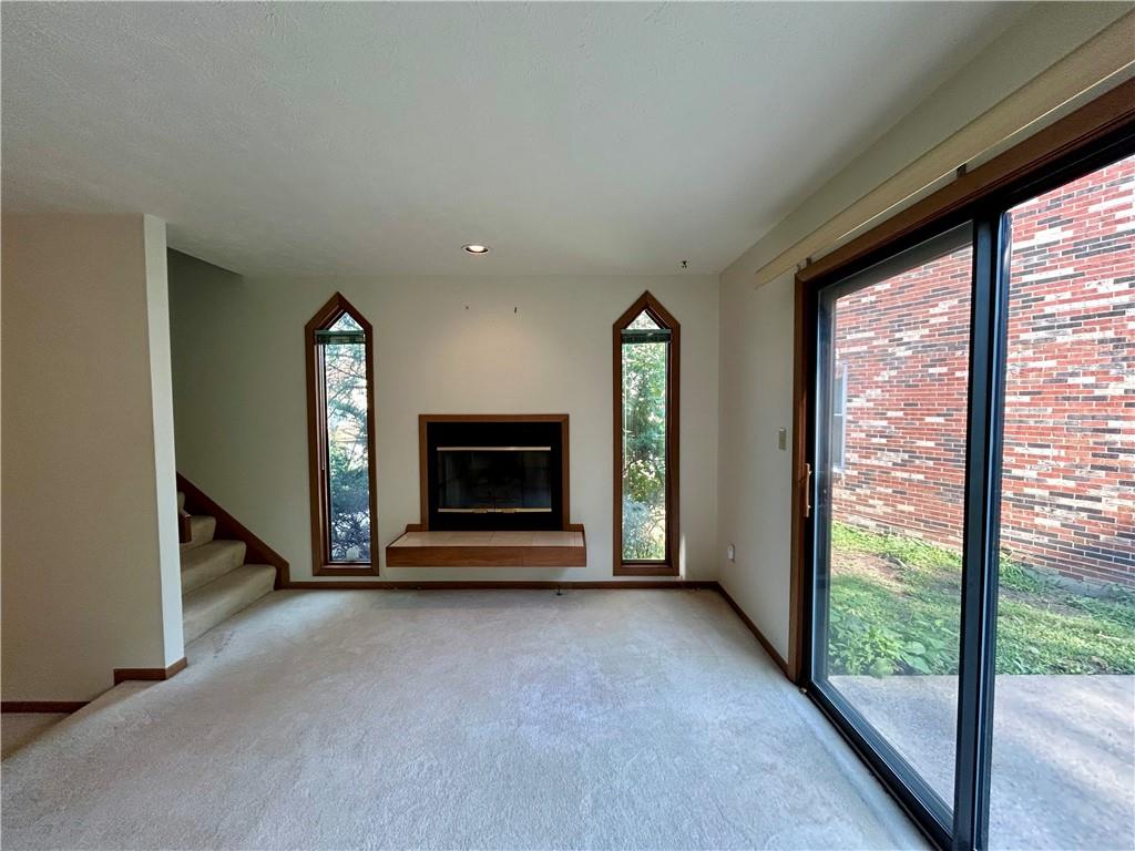 401 Spring Run Drive Monroeville, PA 15146 - Photo 16 of 31 a view of an empty room with a fireplace and a window