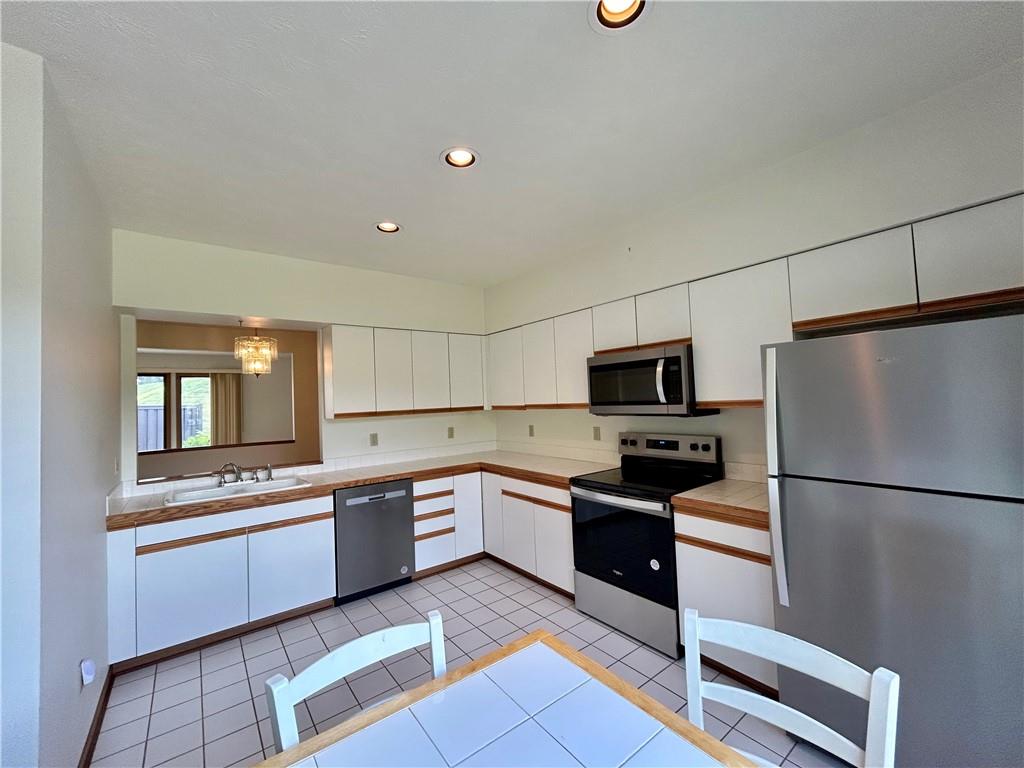 401 Spring Run Drive Monroeville, PA 15146 - Photo 5 of 31 a kitchen with granite countertop stainless steel appliances and refrigerator