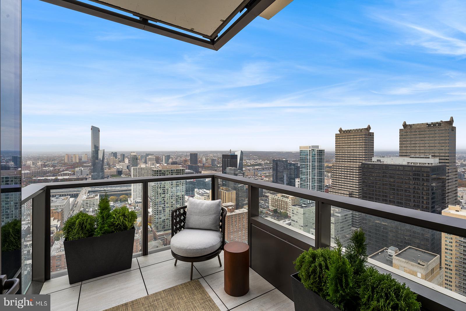 1911 Walnut Street, Unit 3003 Philadelphia, PA 19103 - Photo 11 of 27 a view of a balcony with wooden floor and outdoor seating