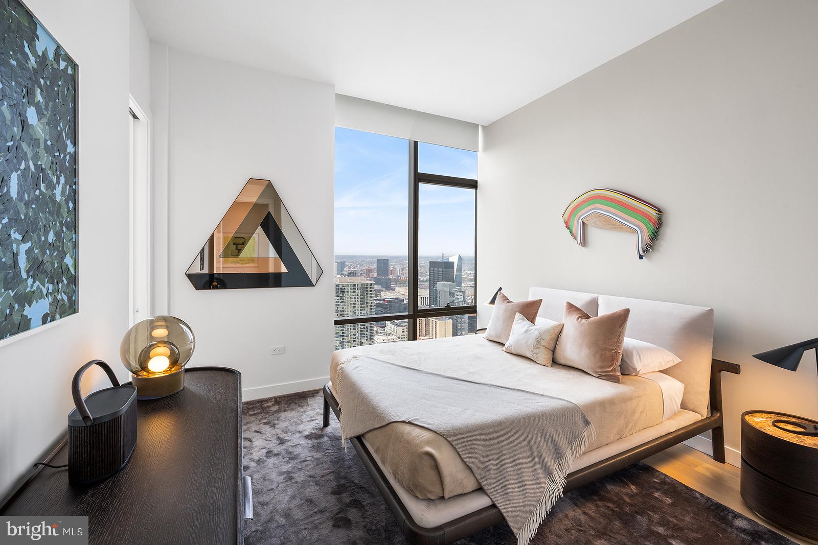 1911 Walnut Street, Unit 3003 Philadelphia, PA 19103 - Photo 12 of 27 a bedroom with bed and a window