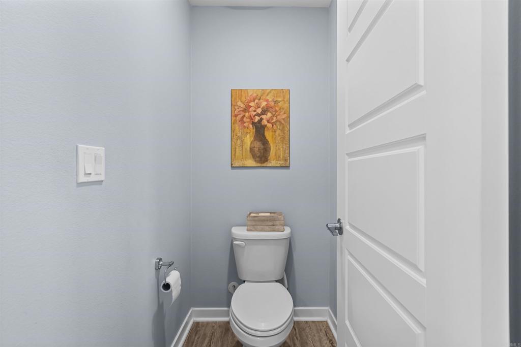 29809 Gypsy Vanner Way Menifee, CA 92584 - Photo 34 of 45 a white toilet sitting next to a white sink