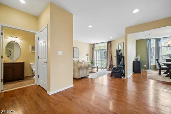 a dining room with furniture a chandelier and a rug