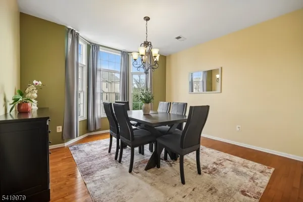 a view of a workspace with wooden floor