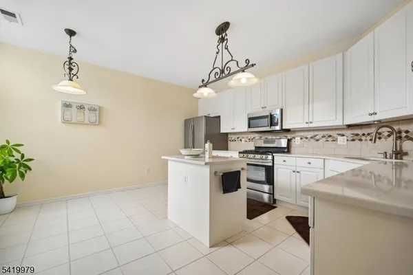 a bedroom with a bed and lamps