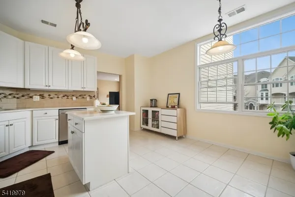 a bathroom with a tub and toilet