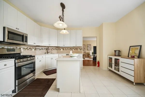 a spacious bedroom with a bed and a window