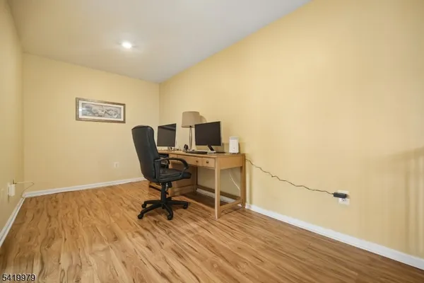 a bedroom with a bed and a table