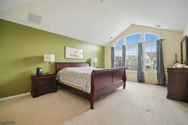 a room with pool table and windows