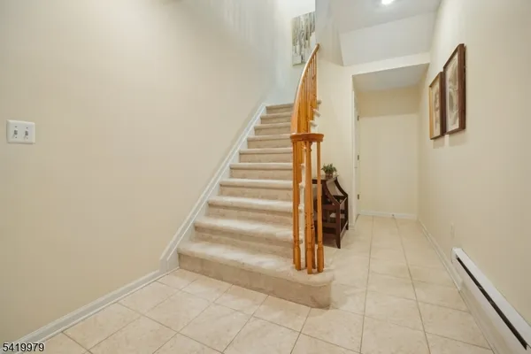 a living room with furniture large window and a fireplace