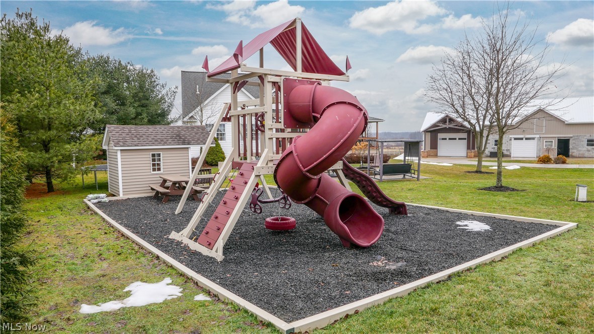 9561 Creaser Road North Bloomfield, OH 44450 - Photo 31 of 45 Community jungle gym featuring a lawn