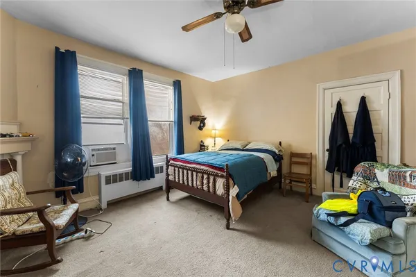 a bedroom with bed and a window