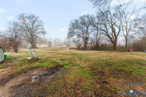 a view of a field with trees