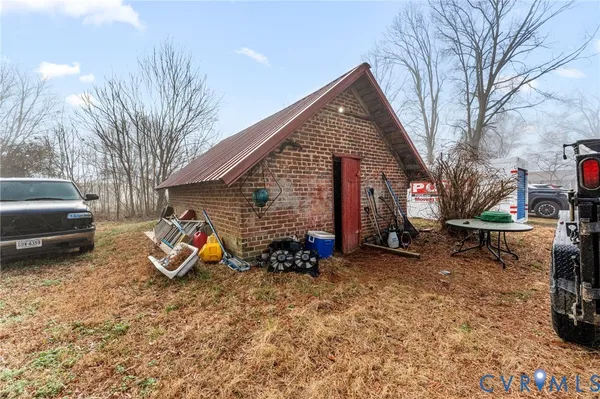 a view of a house with a large window and sitting area