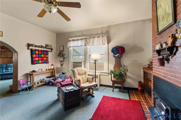 a living room with furniture and a rug