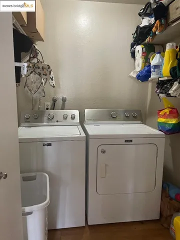 a kitchen with stainless steel appliances a sink window and cabinets