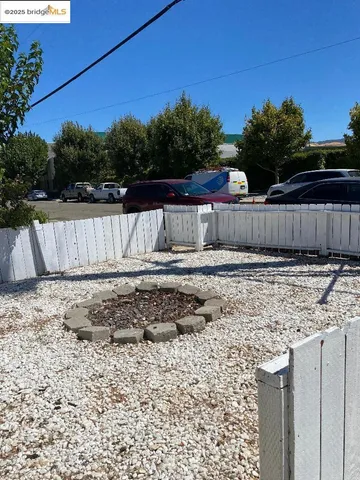 a view of a backyard of the house