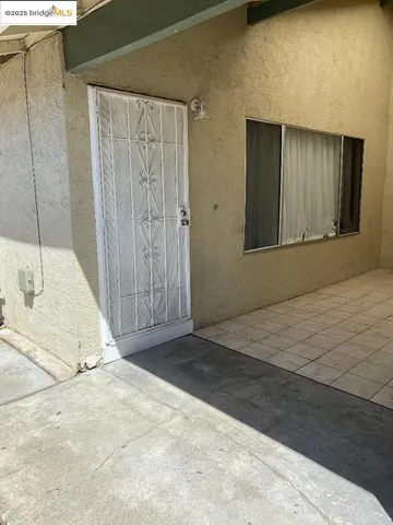 a view of balcony with wooden floor and seating space