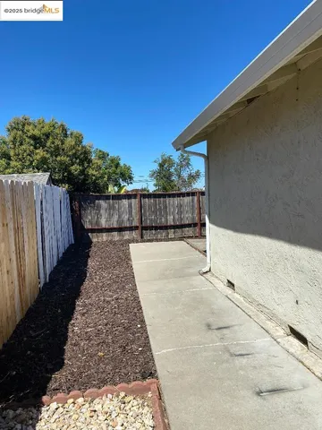 a terrace with wooden fence