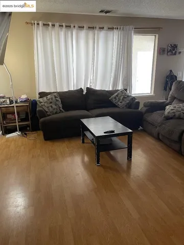 a living room with furniture and a rug