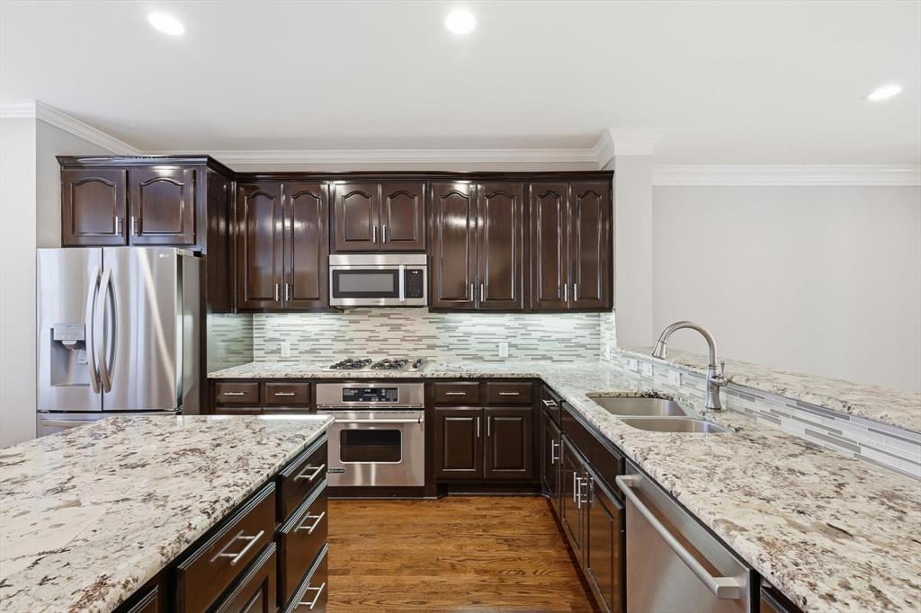2615 Colby Street, Unit B Dallas, TX 75204 - Photo 15 of 39 2nd floor kitchen with gas cooktop, convection oven, granite counterops